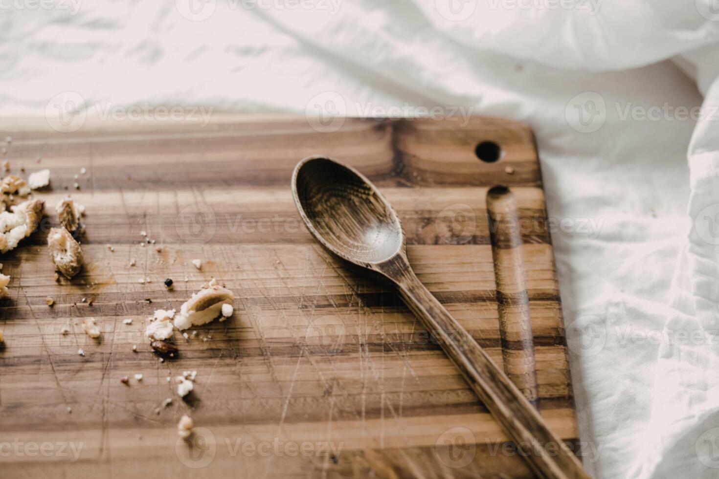 A photograph of a well-worn acacia wood cutting board photo
