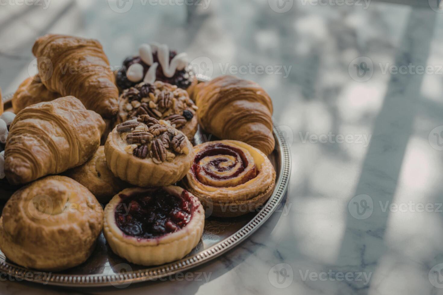 a rustic wooden tray overflowing with freshly baked pastries photo