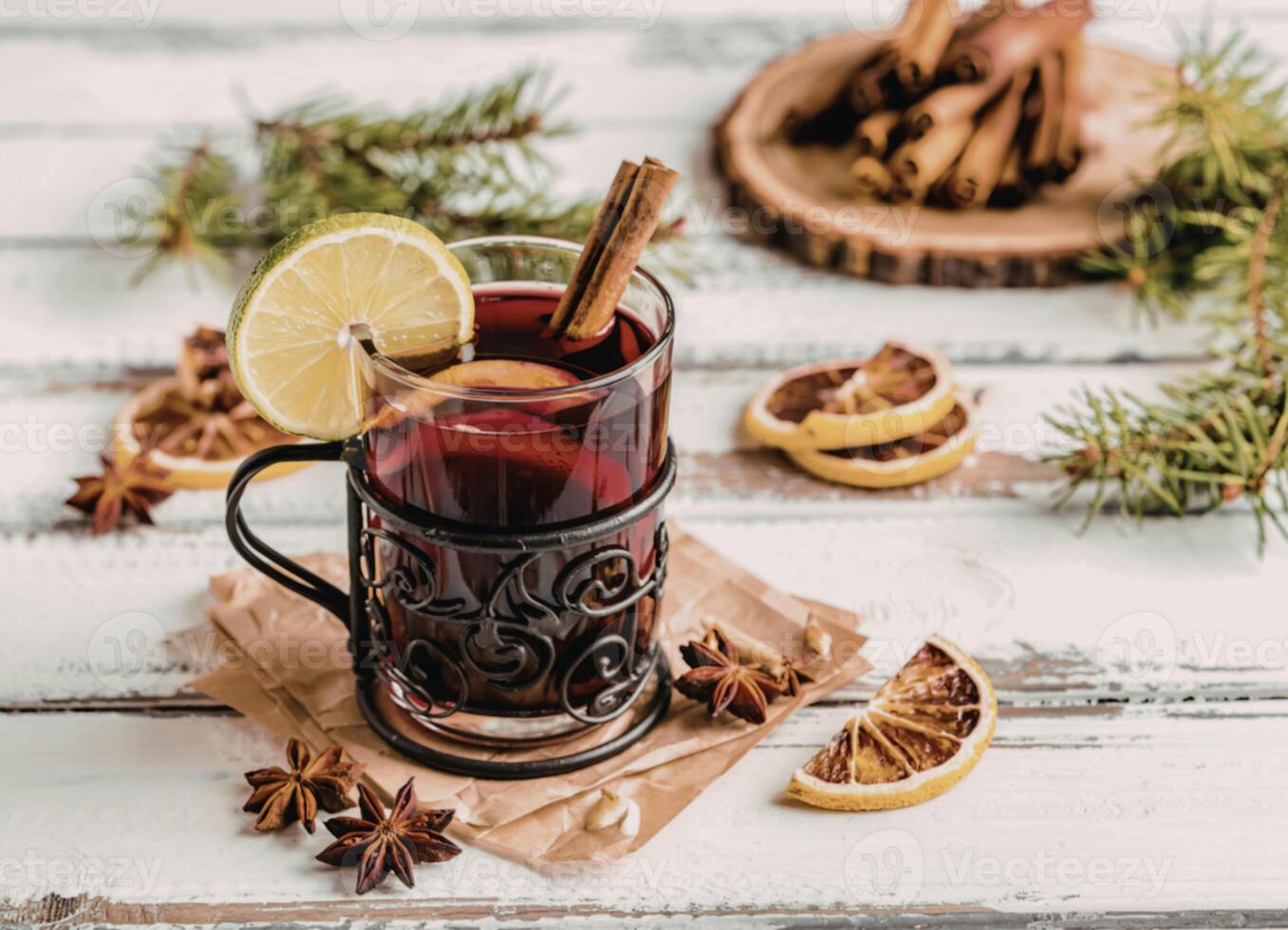 Spiced drink with lemon and cinnamon photo