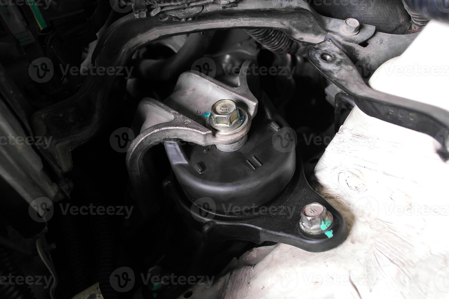 Engine mount or motor mount close-up, engine vibration damper, car part for auto repair, vehicle maintenance. photo