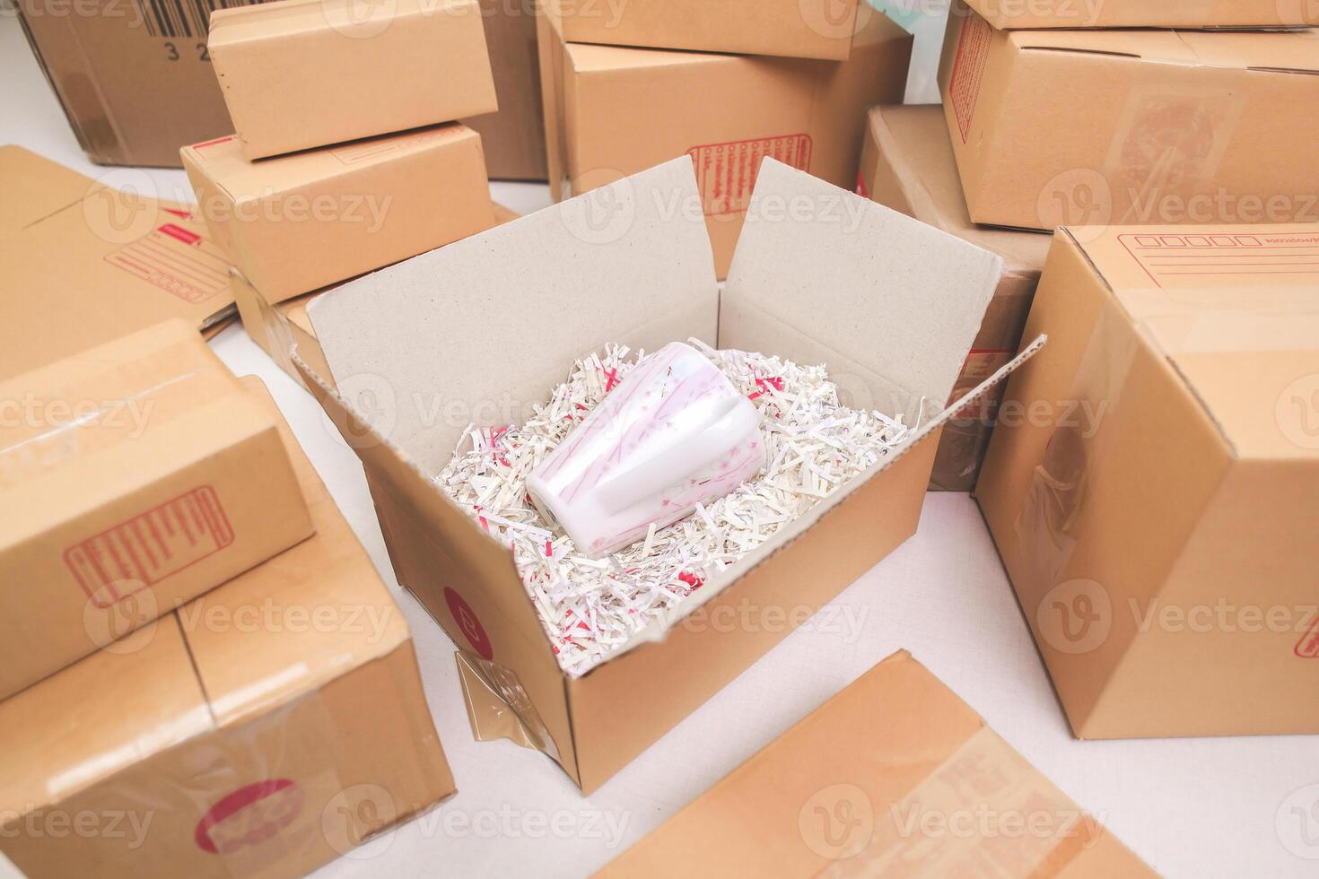 Open shipping box, unboxing or packed a package. Delivery, online shopping e-commerce, moving logistics. photo