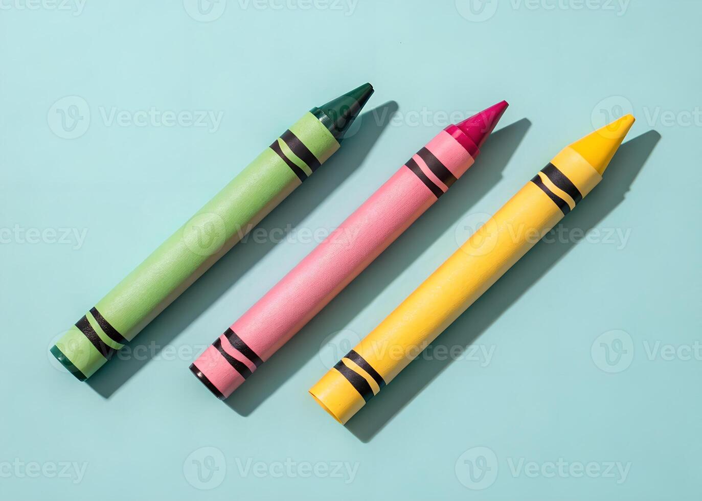 A Minimalist Flat Lay of Three Pink and Green Crayons photo