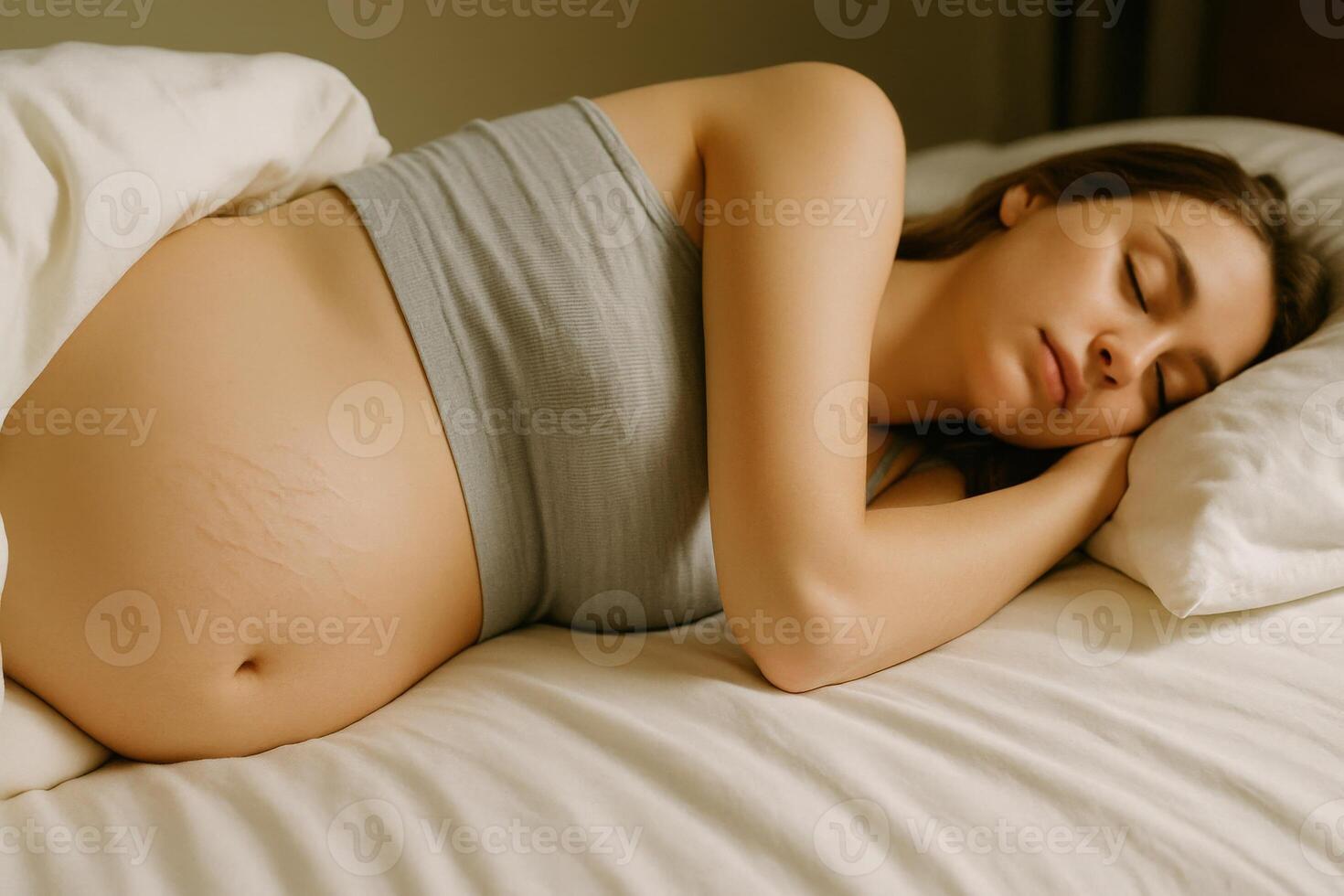A serene pregnant woman lies on her side in a cozy bedroom, resting peacefully. The soft sunlight filters in, creating a warm and tranquil atmosphere perfect for relaxation. photo