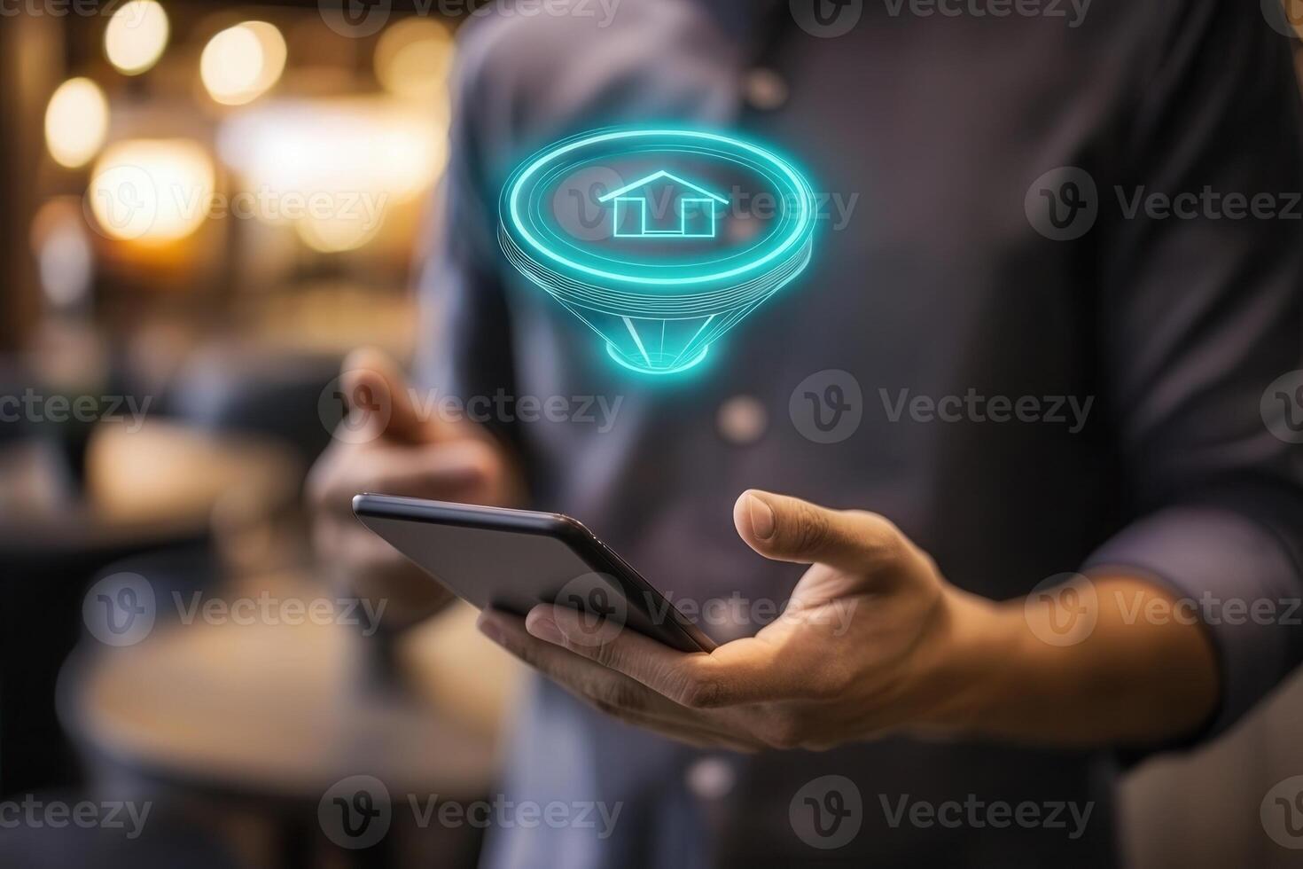 Man holding smartphone with home light bulb icon on screen photo