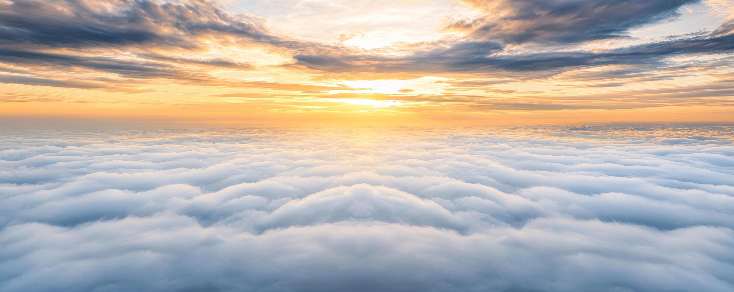 Vibrant sunset over a sea of clouds, creating a serene atmosphere. Cloud formations and skies serene, aesthetic, atmosphere, tranquil, panoramic concept. photo