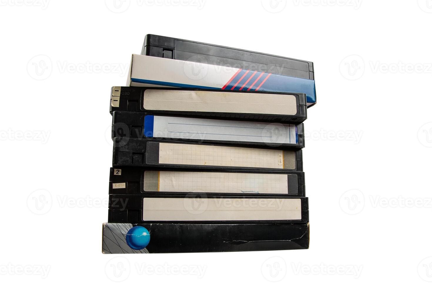 Stack of Eight Old VHS Tapes with Mixed Labels photo