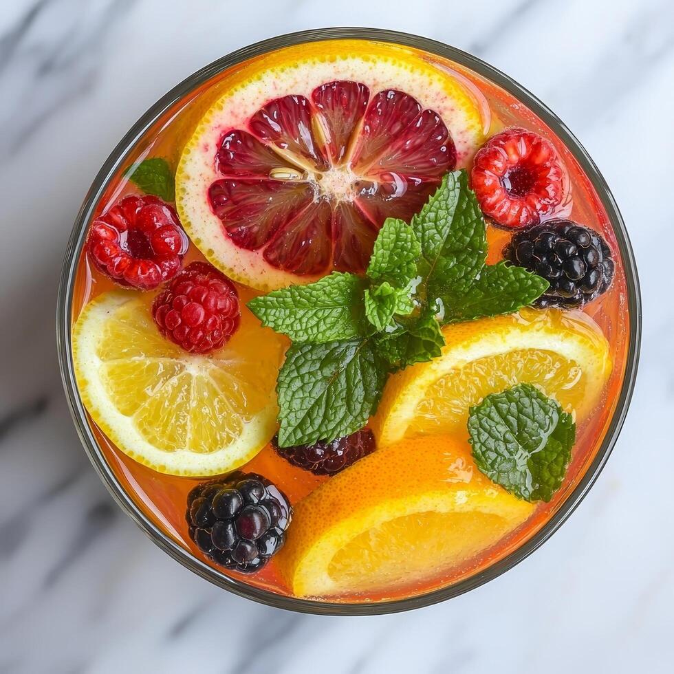 Refreshing fruit-infused drink with citrus and berries. photo