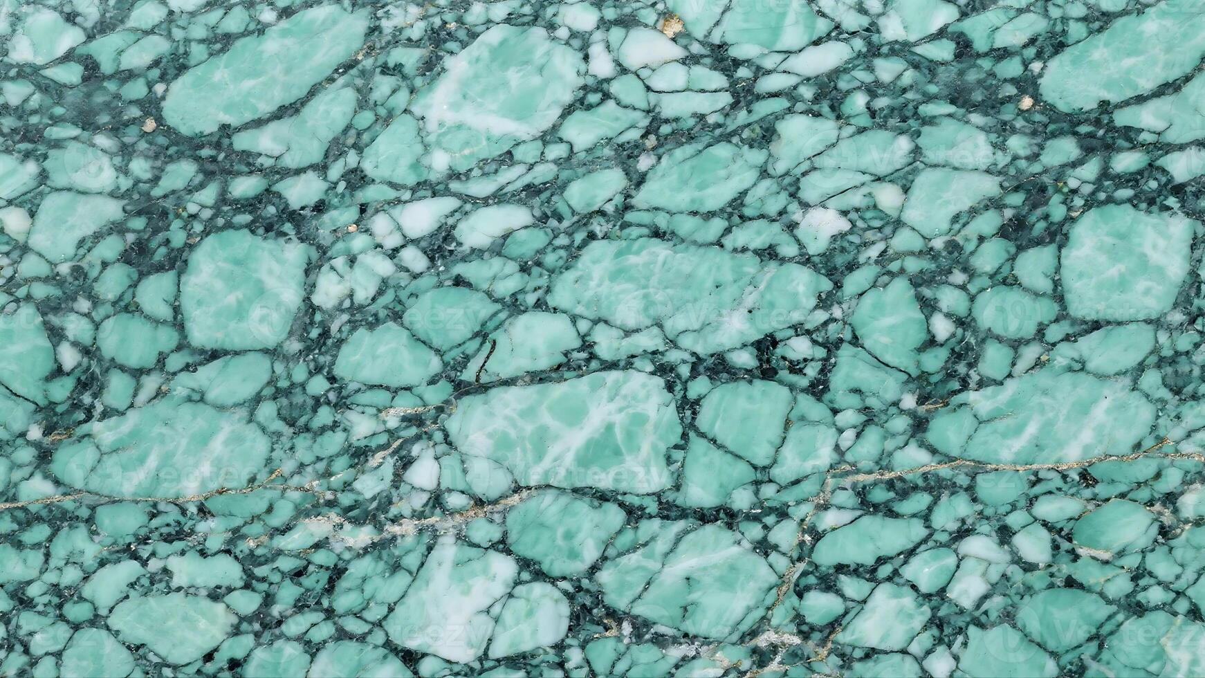Close-up of a polished green granite marble stone surface with veins and textures photo