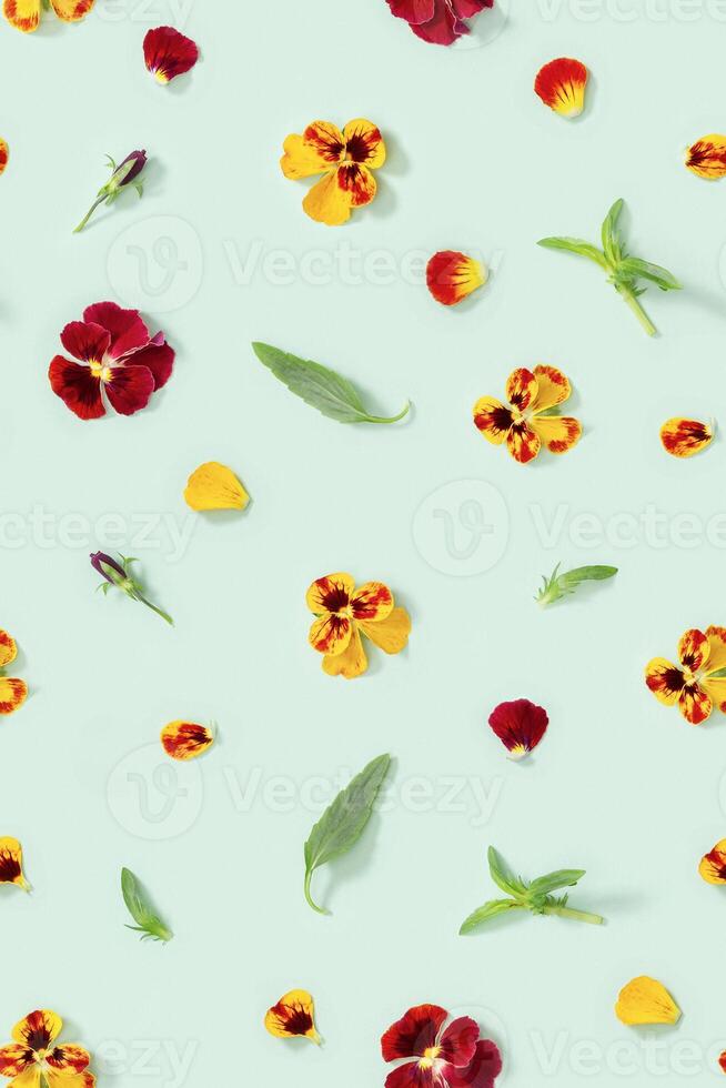 Modern floral seamless pattern with pansy flowers, green leaves and petals, small summer flowery ornament. photo