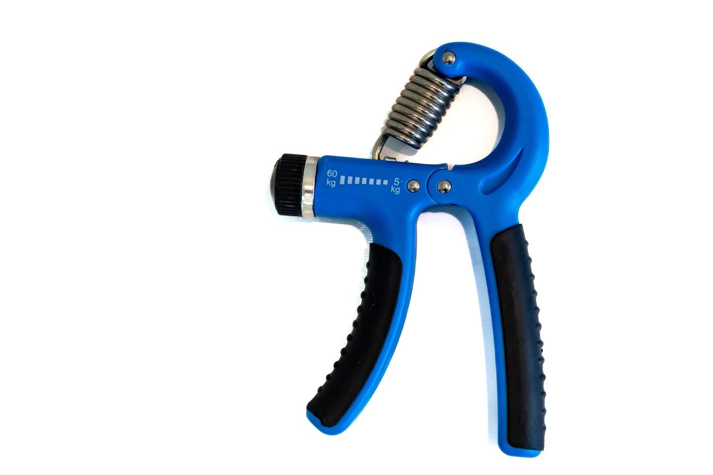 Blue hand grippers for strength training and exercise isolated photo