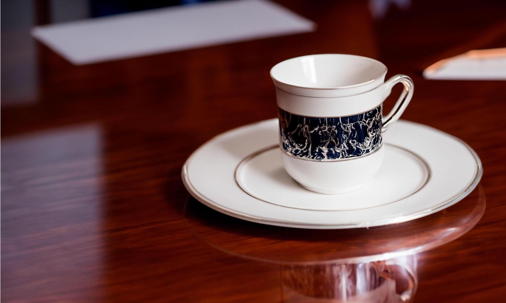 Office Meeting Setup with Business Accessories on clean and minimalist table coffee cup photo