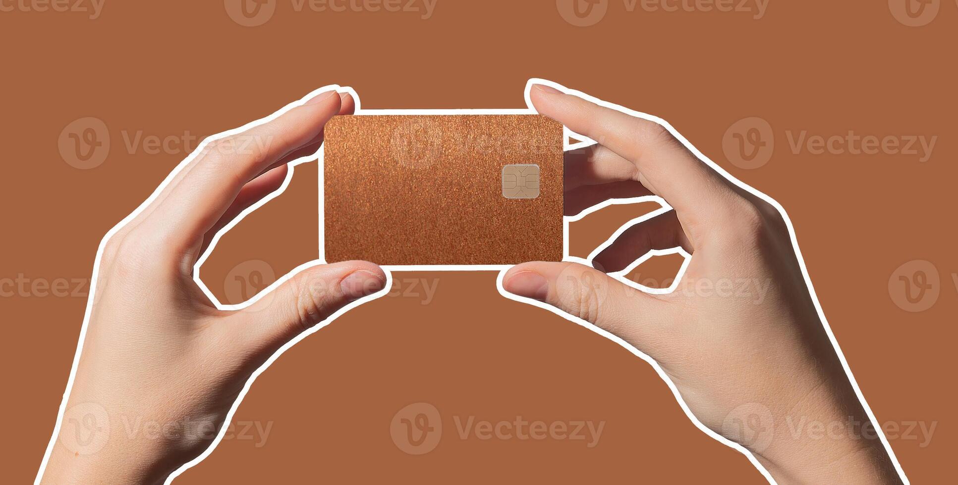 Colorful finance service. Hand holding bright plastic bankcard with chip in closeup for credit, photo