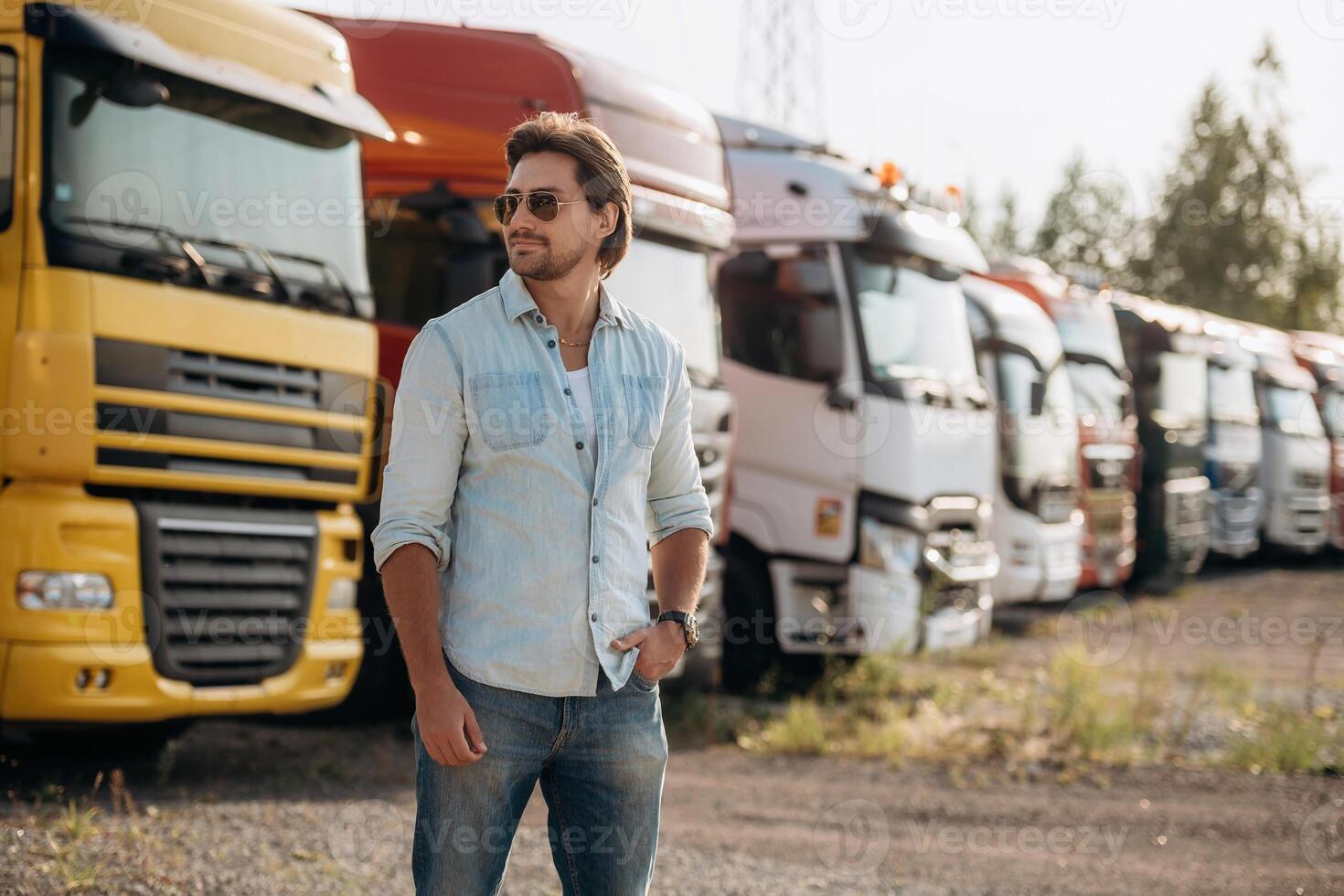 Eyewear, cool look in ,,the, sunglasses, standing. Truck driver is near the transport outdoors photo