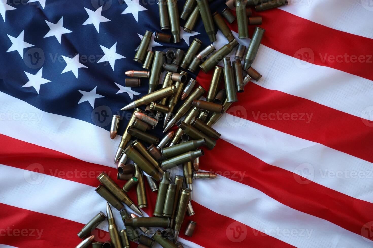 Bullets with USA flag in dark light. Patriotic background image with ammo and United States flag photo