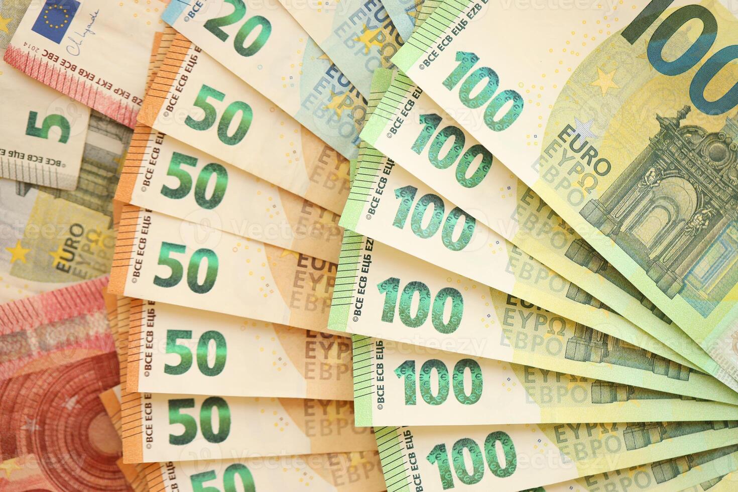 Pile of euro banknotes as finance background photo