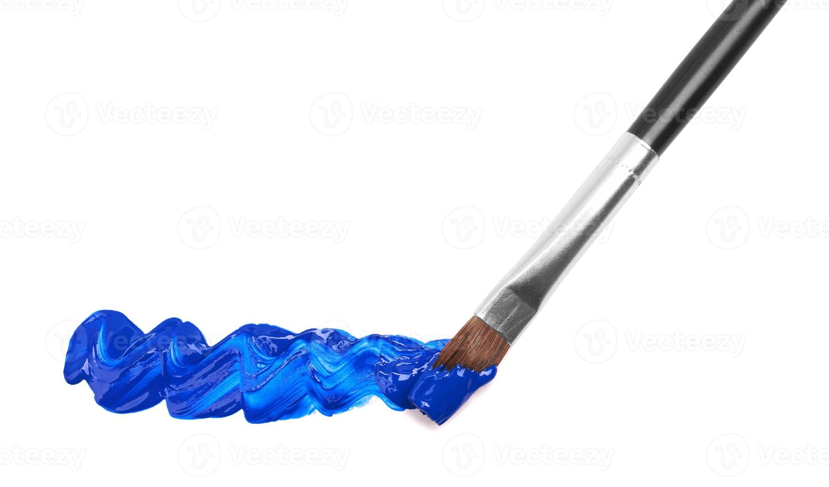 Paint brush with blue paint photo