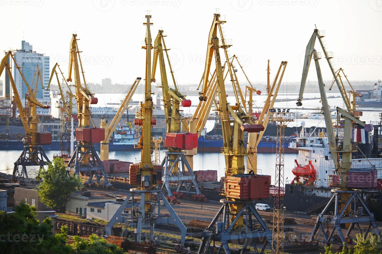 View on the port with loading cargo ship photo