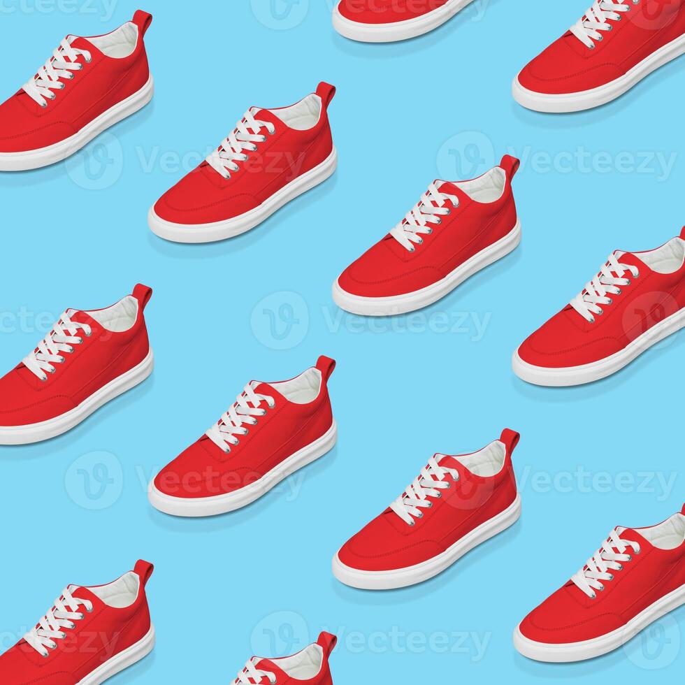 Red sneaker on a blue background. Pop art design. Flat minimal lay style. photo