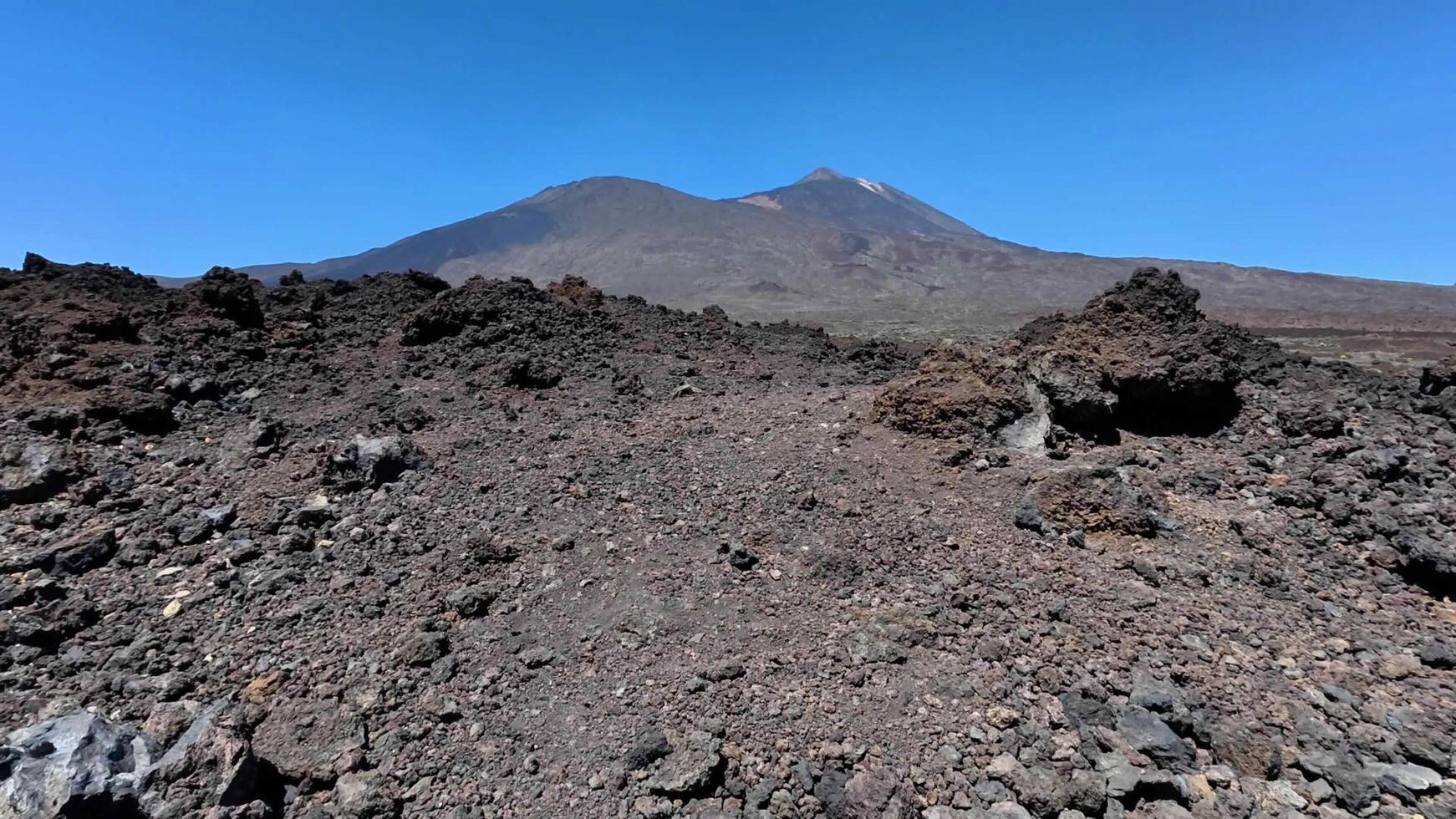 Experience the Stunningly Beautiful Views of the Volcanic Landscape Beneath Bright Blue Skies photo