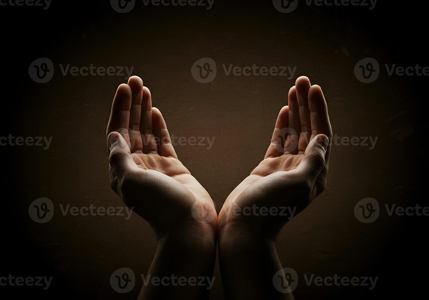 Hands reaching out to the sky, with a dark background photo