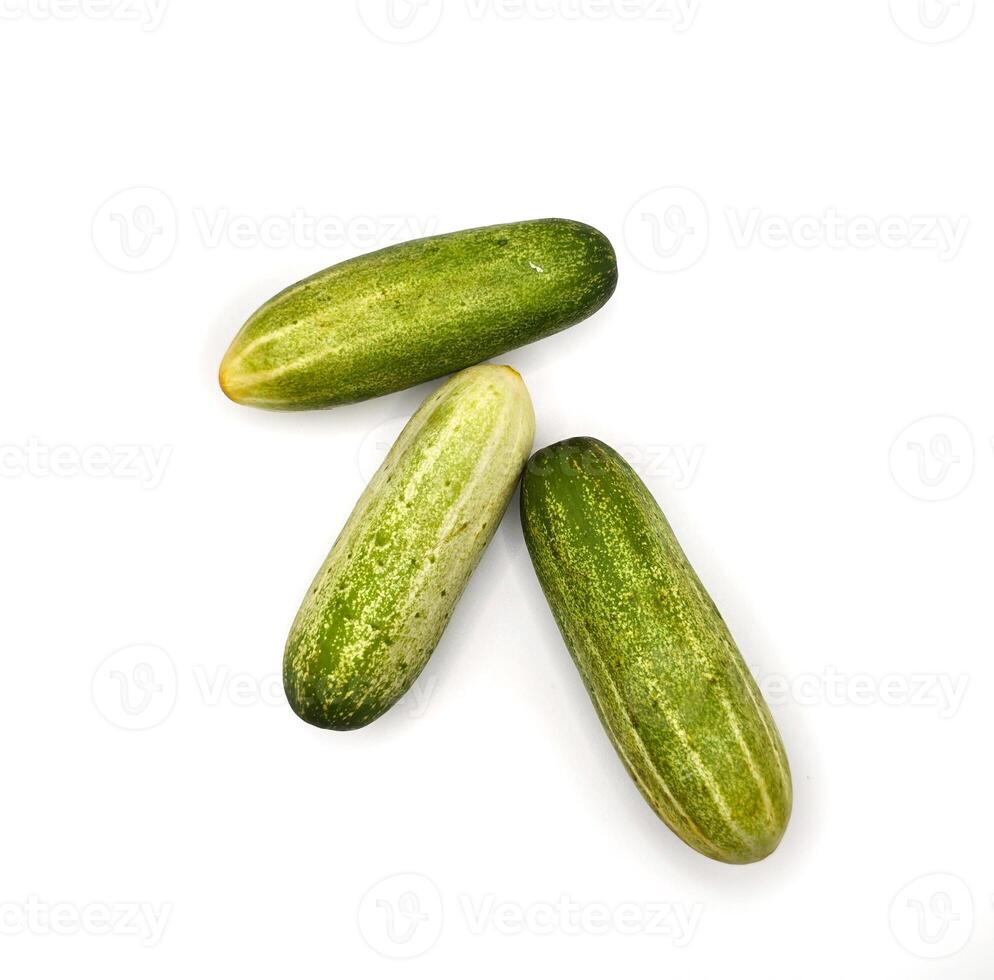 Fresh Organic Cucumbers Isolated on White Background. Group of Green Cucumbers on Clean White Surface. Healthy Green Cucumbers for Diet and Nutrition Design. High resolution image. photo