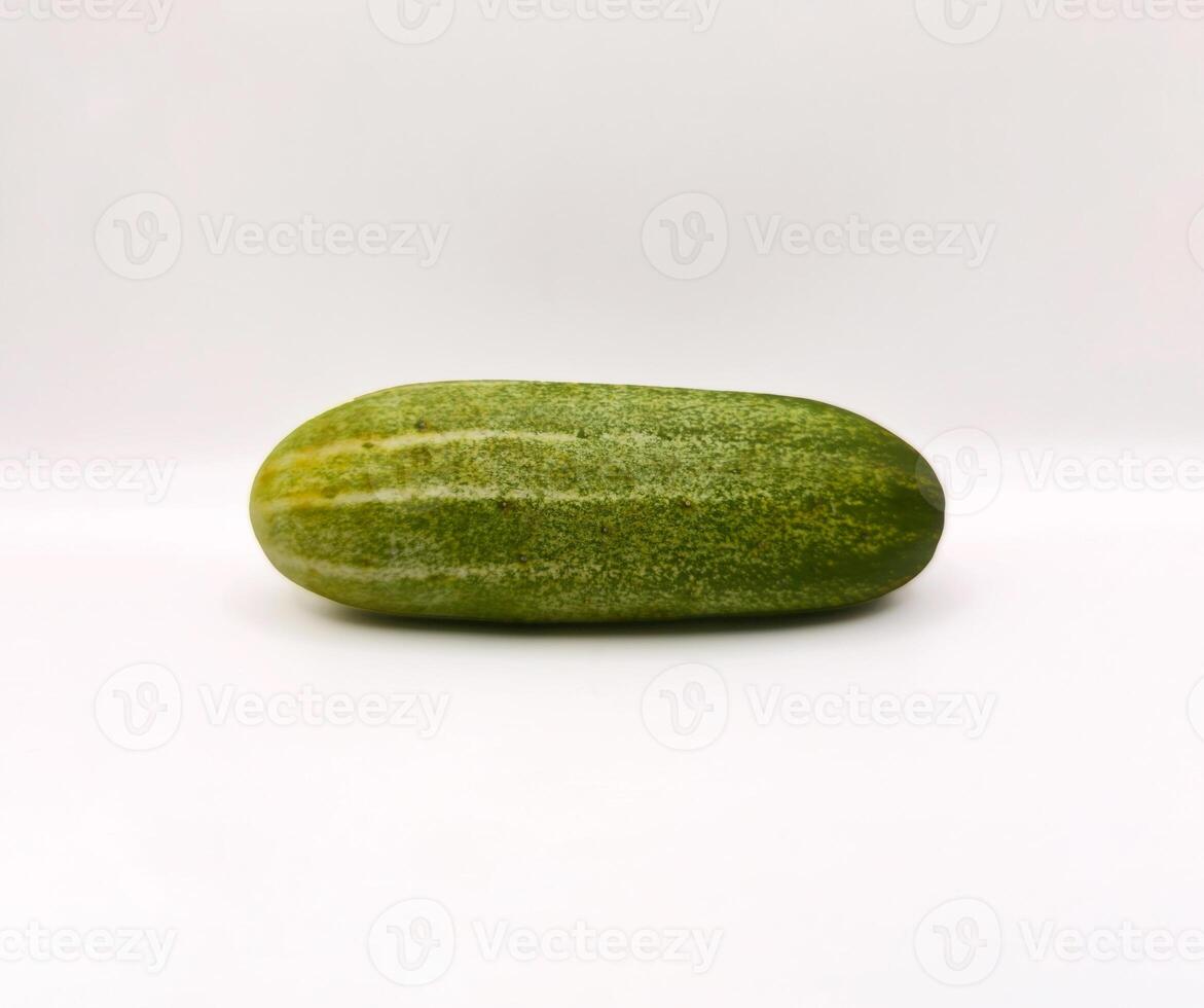 Fresh Organic Cucumbers Isolated on White Background. Group of Green Cucumbers on Clean White Surface. Healthy Green Cucumbers for Diet and Nutrition Design. Top View high resolution image. photo
