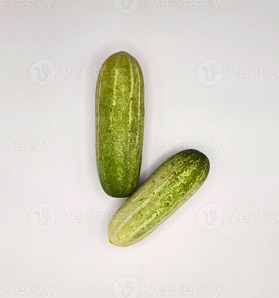 Fresh Organic Cucumbers Isolated White Background. Group of Green Cucumbers on Clean White Surface. Healthy Green Cucumbers for Diet and Nutrition Design. Top View high resolution image photo