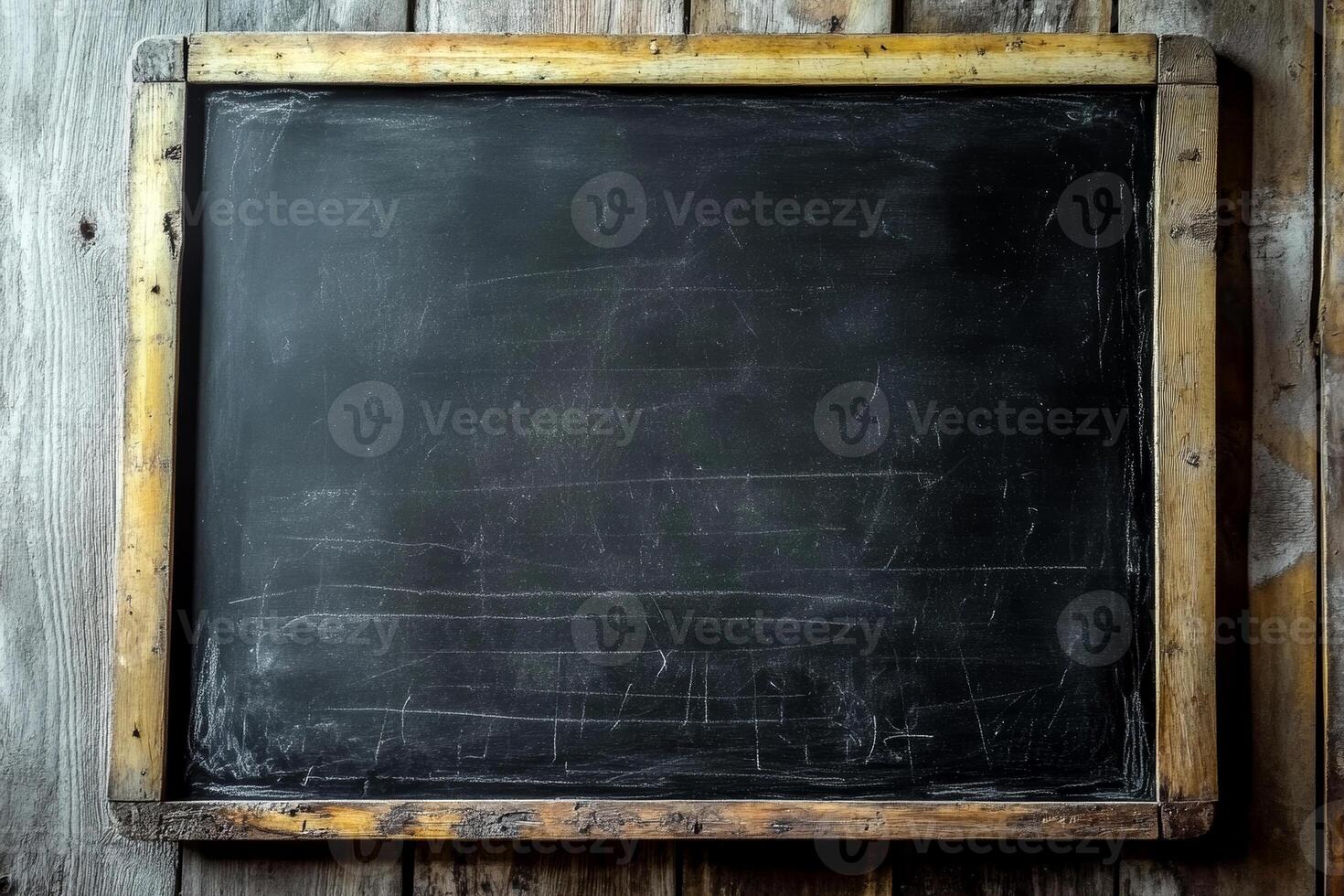 A blank chalkboard against a weathered wood backdrop awaits notes or drawings, brimming with potential and creativity photo