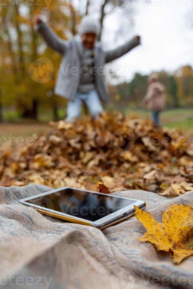 A tablet on a blanket photo
