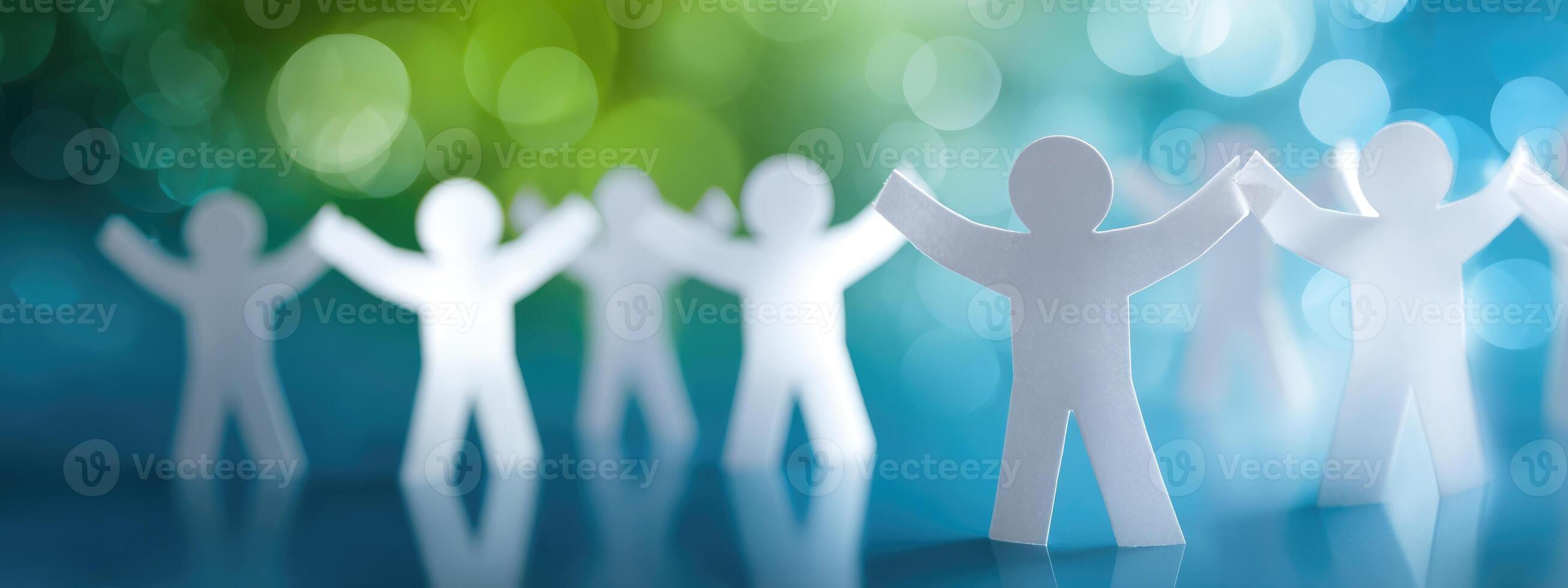 A group of paper people standing in a circle photo