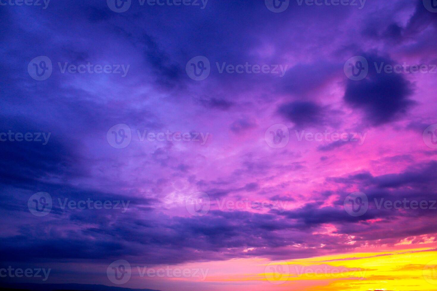 a purple sky with a purple and orange horizon and a purple cloud. Dramatic sky. Spectacular Sky at Sunset. photo