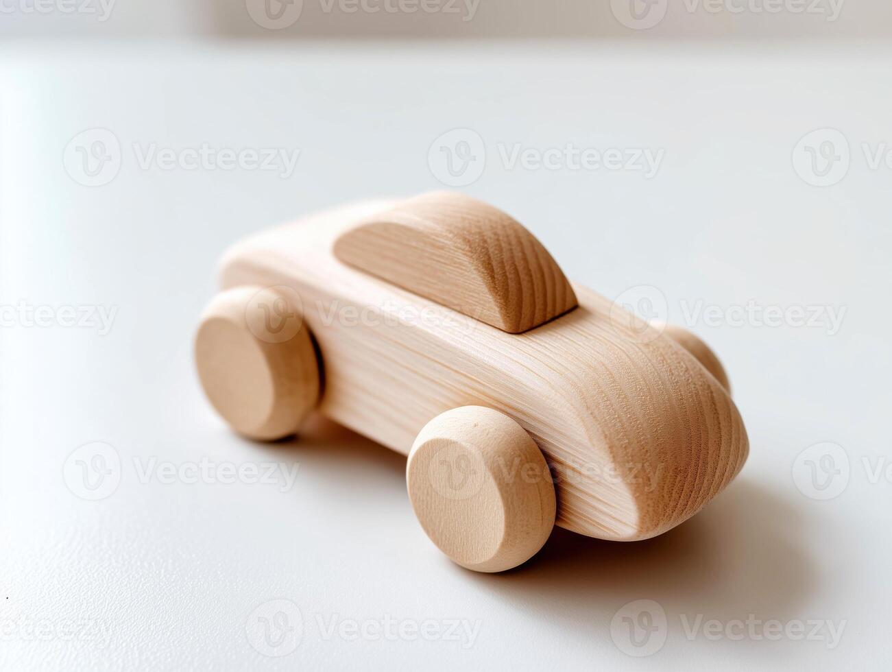 Minimalist wooden toy car on a white background. photo