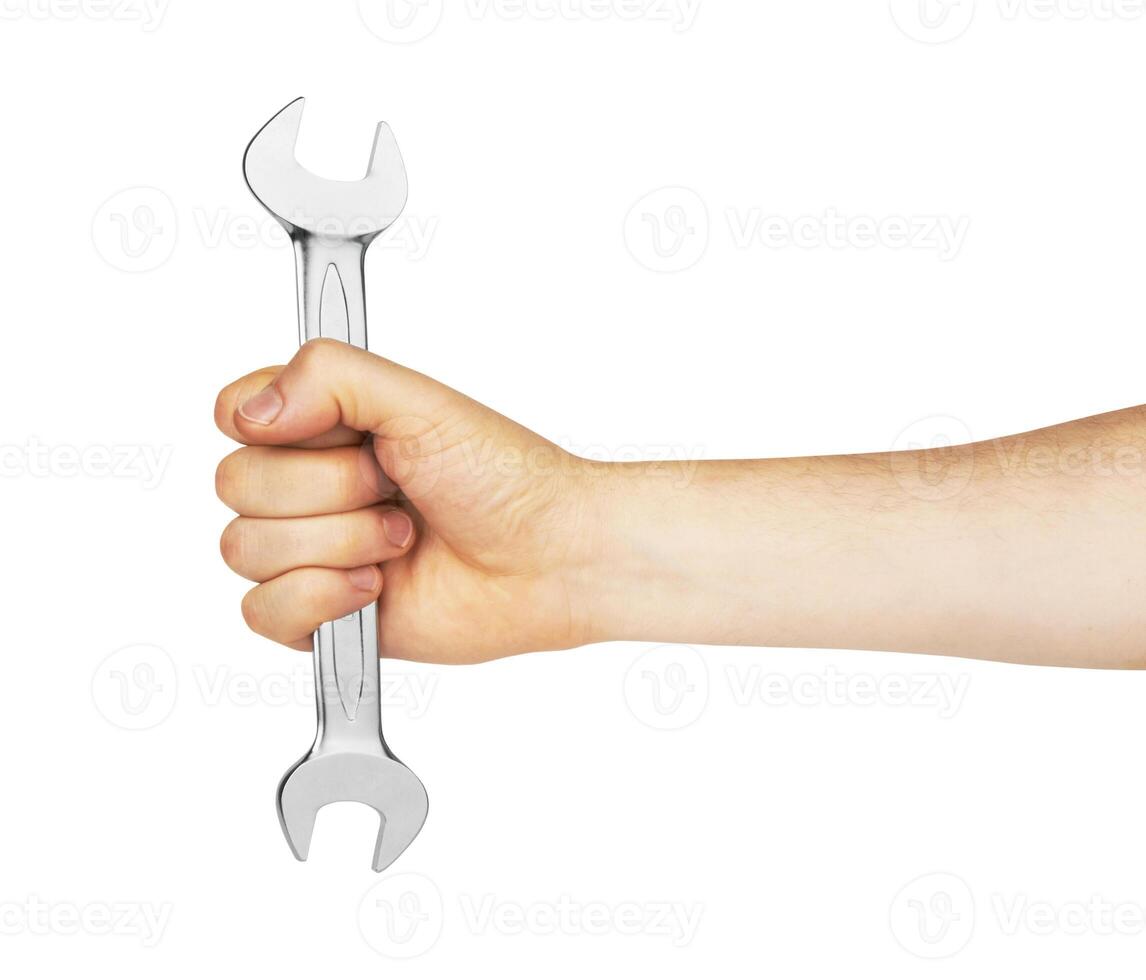 Metal spanner in hand photo