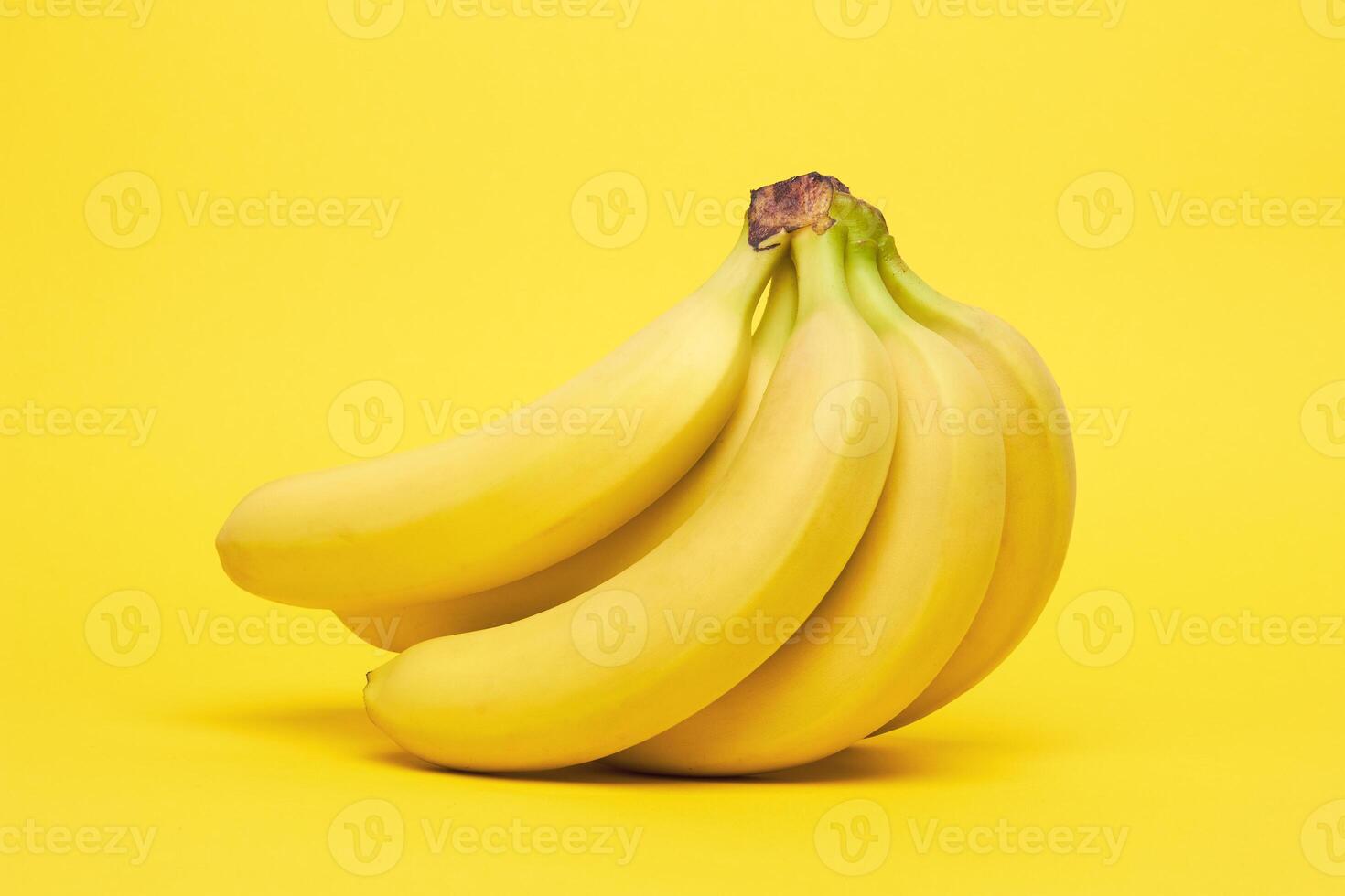 Bananas on a yellow background. photo