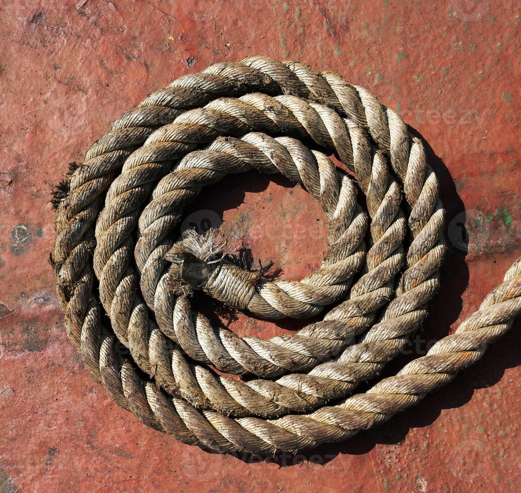 Rope on grunge metal photo