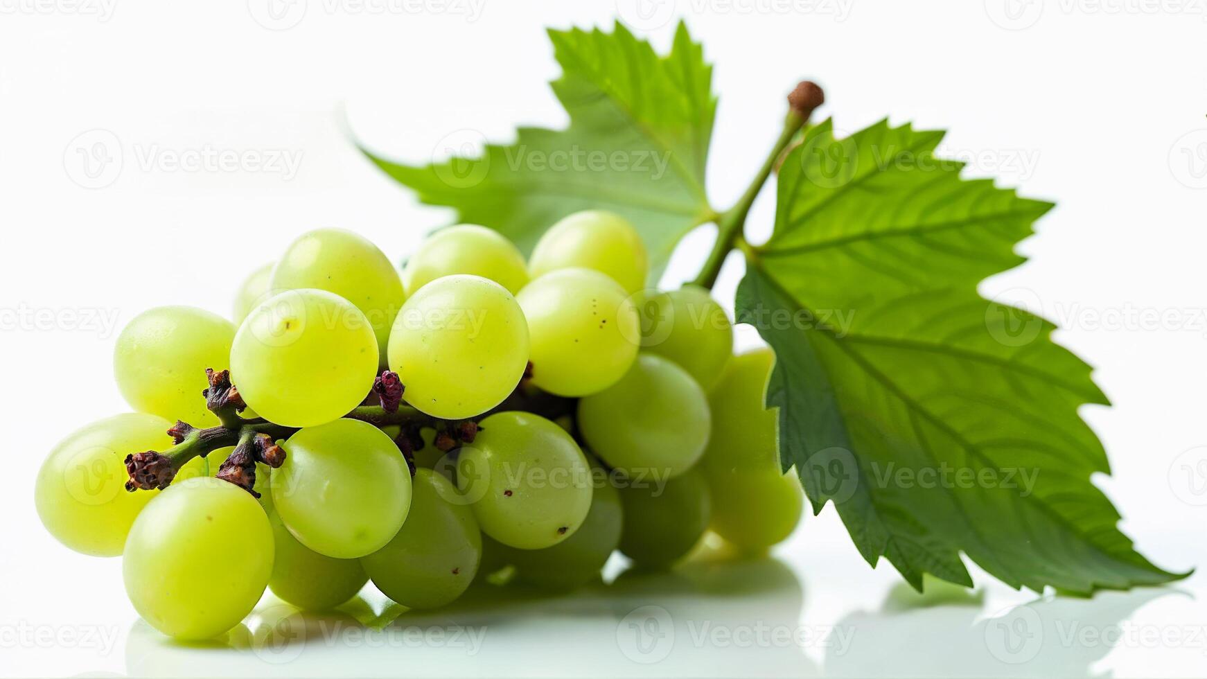A cluster of fresh, juicy green grapes with attached leaves isolated on a white background. Suitable for food, nutrition, healthy eating, and fruit-related concepts in digital or print media. photo