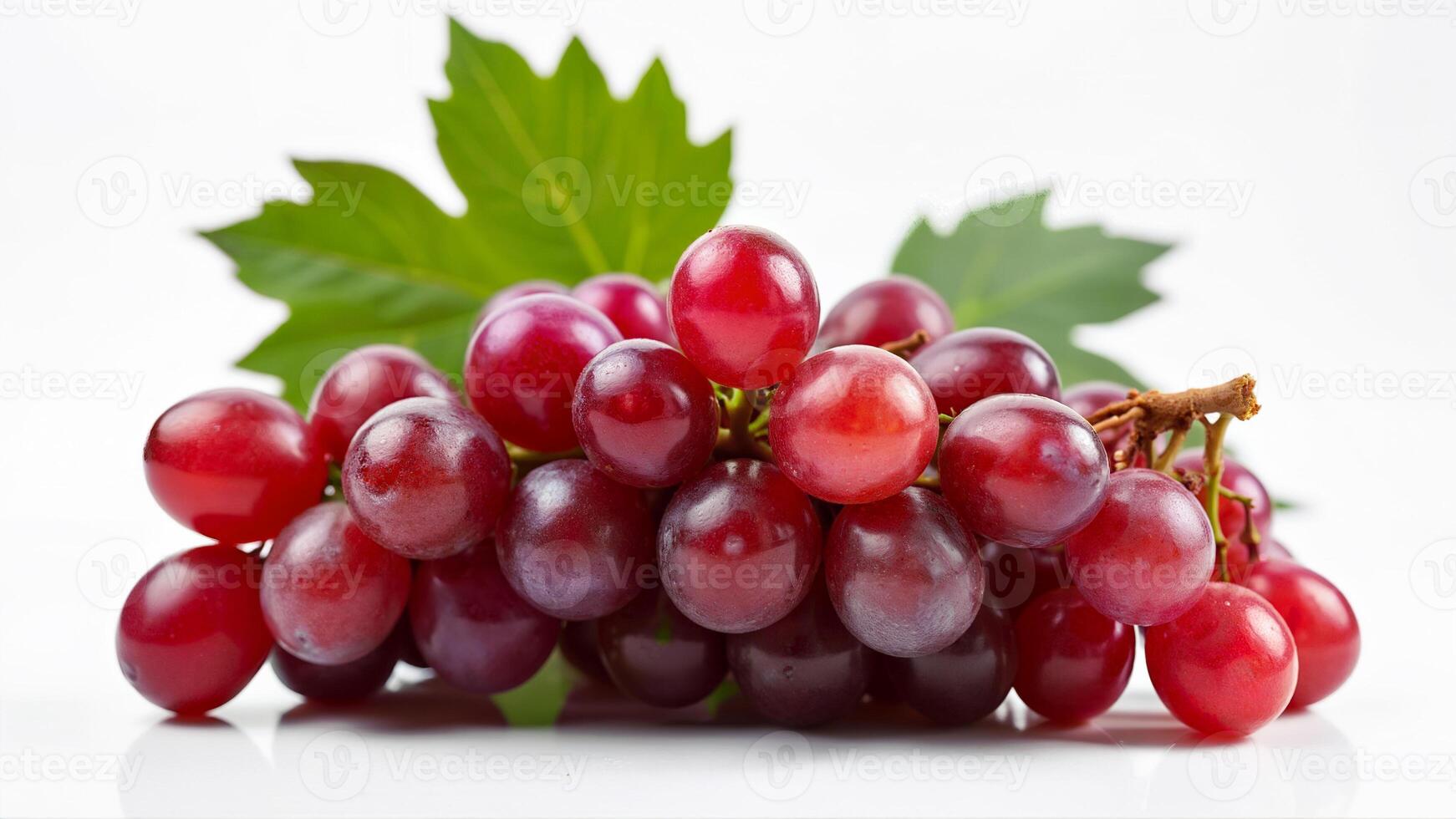 A cluster of juicy red grapes with green leaves is isolated on a white background. Suitable for food, nutrition, and healthy eating concepts in advertising or editorial use. photo