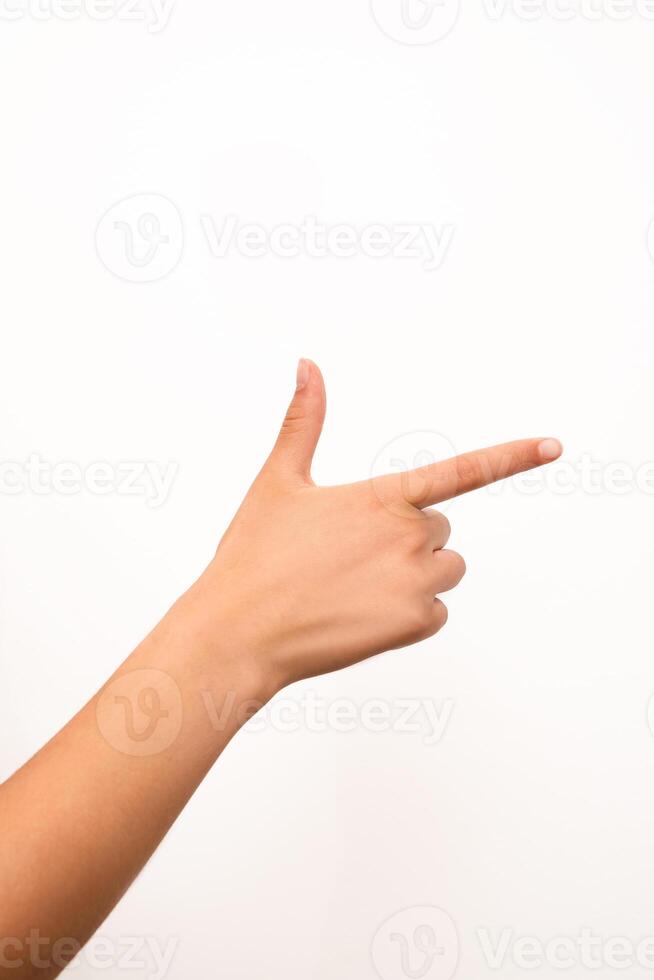 A human hand is making a finger gun gesture, isolated on a plain white background. Suitable for concepts related to communication, direction, or playful gestures in isolated settings. photo
