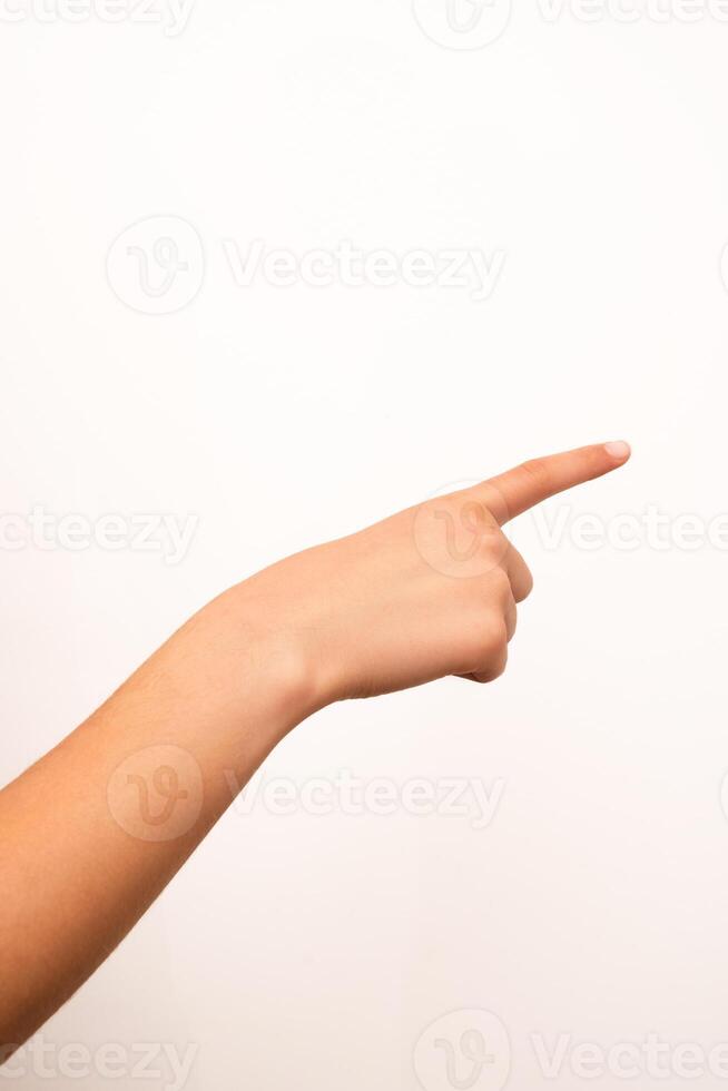 Human hand with extended index finger pointing right, isolated on a plain white background. Suitable for concepts of direction, instruction, or attention in digital or print design. photo