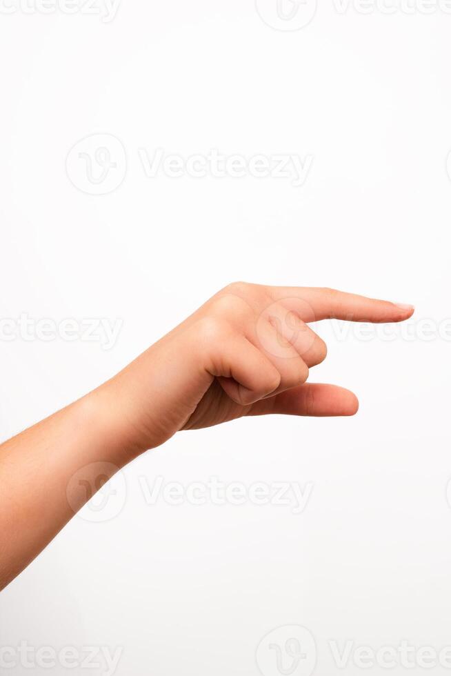 A left human hand with fingers extended in a pointing gesture is isolated on a plain white background. Suitable for concepts involving direction, instruction, or user interface design. photo