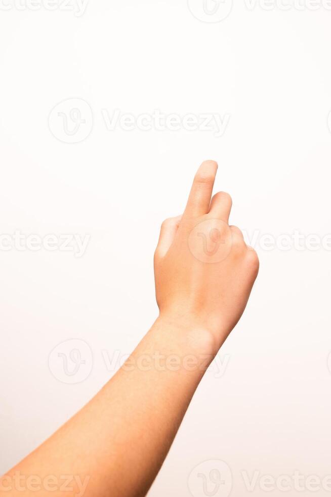 A single human hand with extended index finger is isolated on a plain white background. Suitable for concepts of direction, selection, or interface in digital and print design. photo
