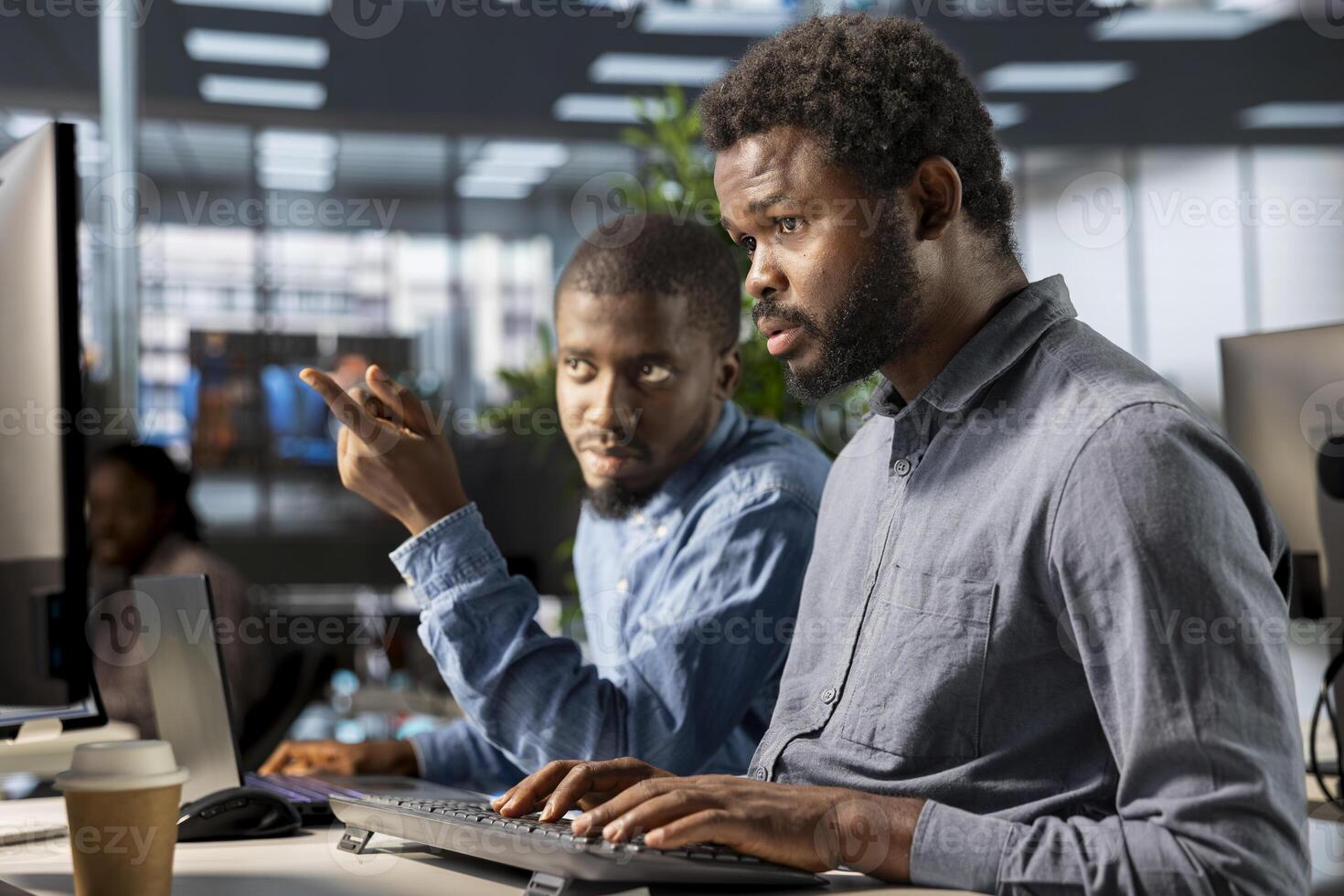 Financial advisor and colleague discussing resource allocations and budget planning in a corporate meeting, strategizing ways to optimize resources and achieve organizational goals. photo