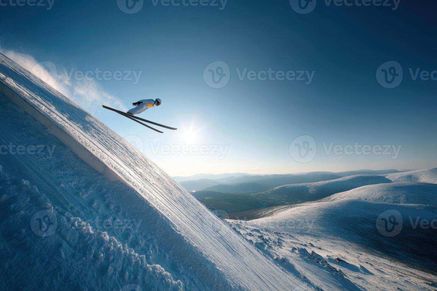 A person on skis jumping off a snowy slope photo