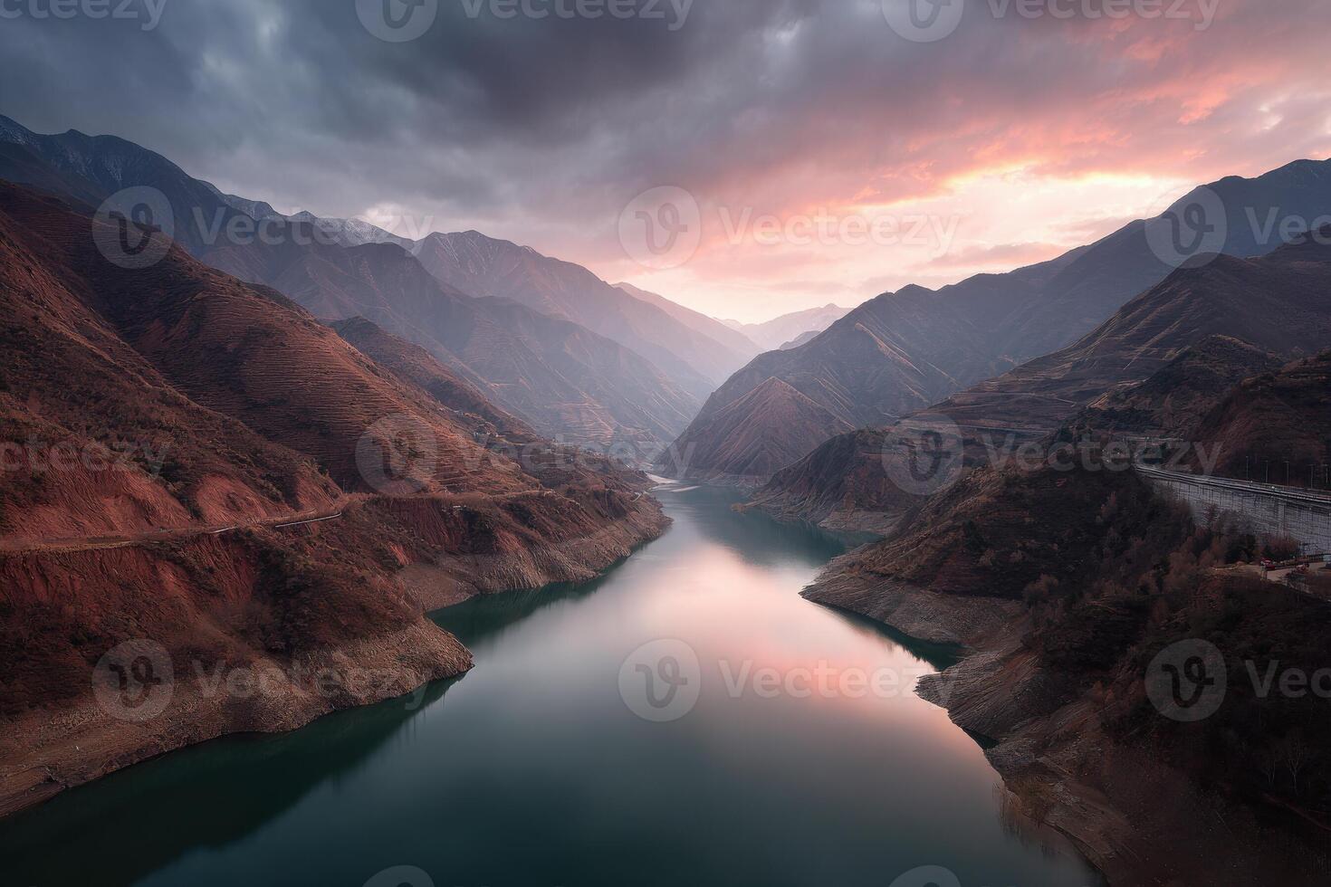 A river flows through a valley surrounded by mountains photo