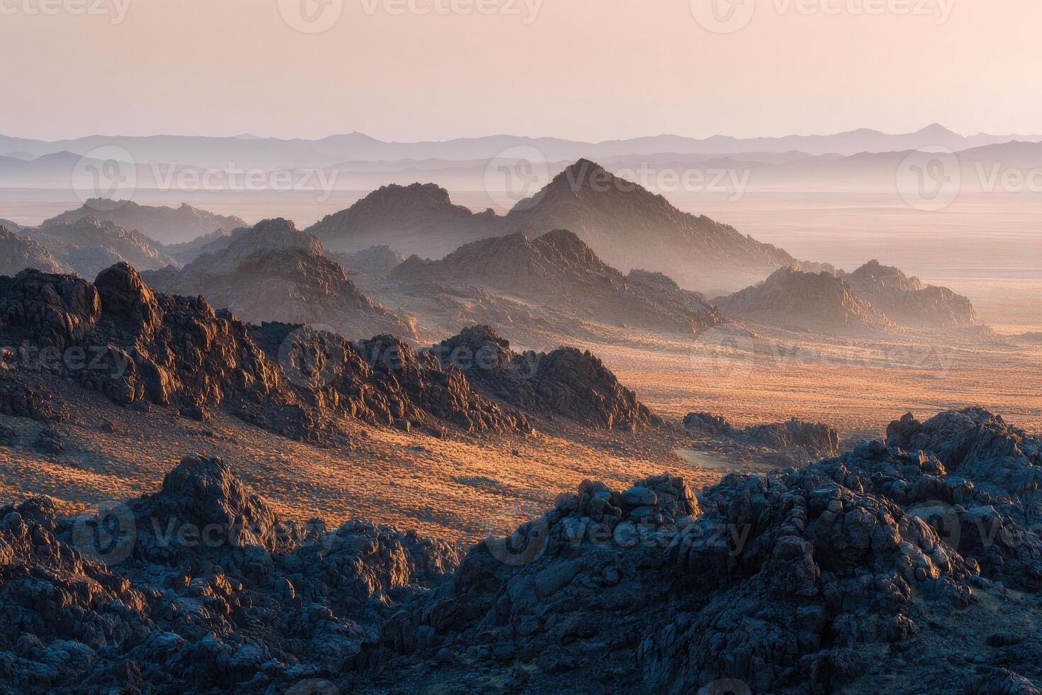 The mountains are covered in dry grass and rocks photo
