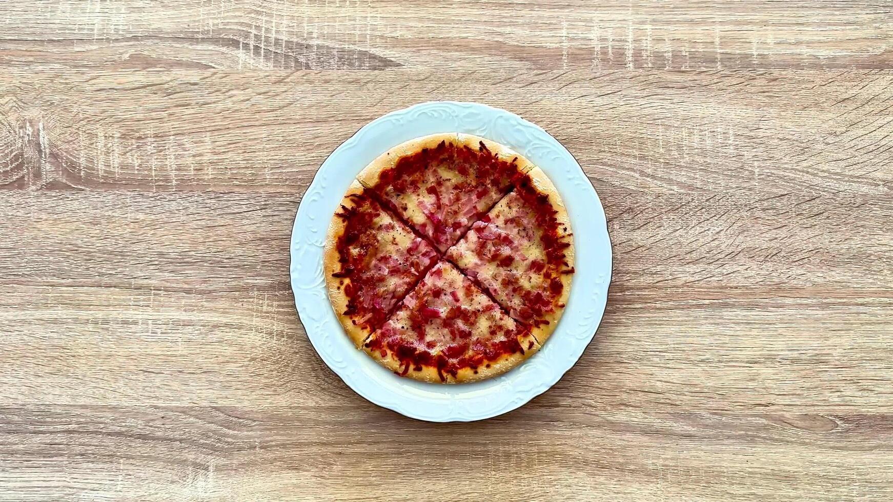 A Delicious Pizza with Various Toppings Spread Out on a Rustic Wooden Table Surface photo