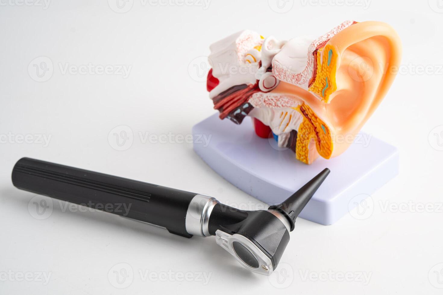 Otoscope isolated on white background for otolaryngologist or ENT physician doctor examining senior patient ear, hearing loss photo