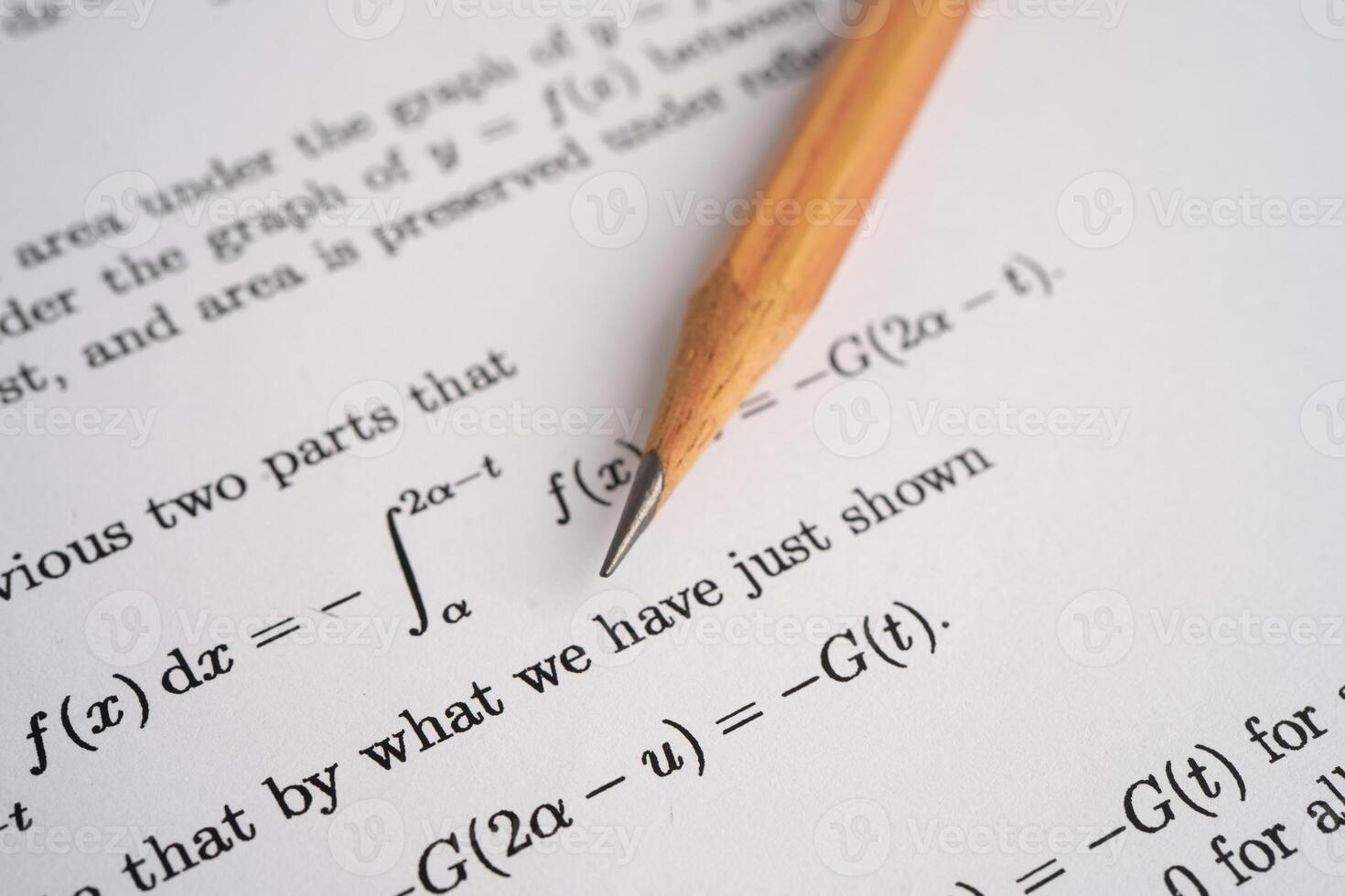 Pencil on mathematic formula exercise test paper photo