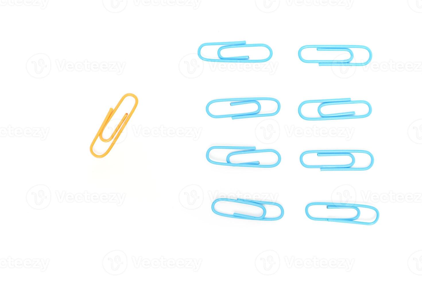 Contrasting Paper Clips on White Backdrop - A Visual Representation of Individuality photo