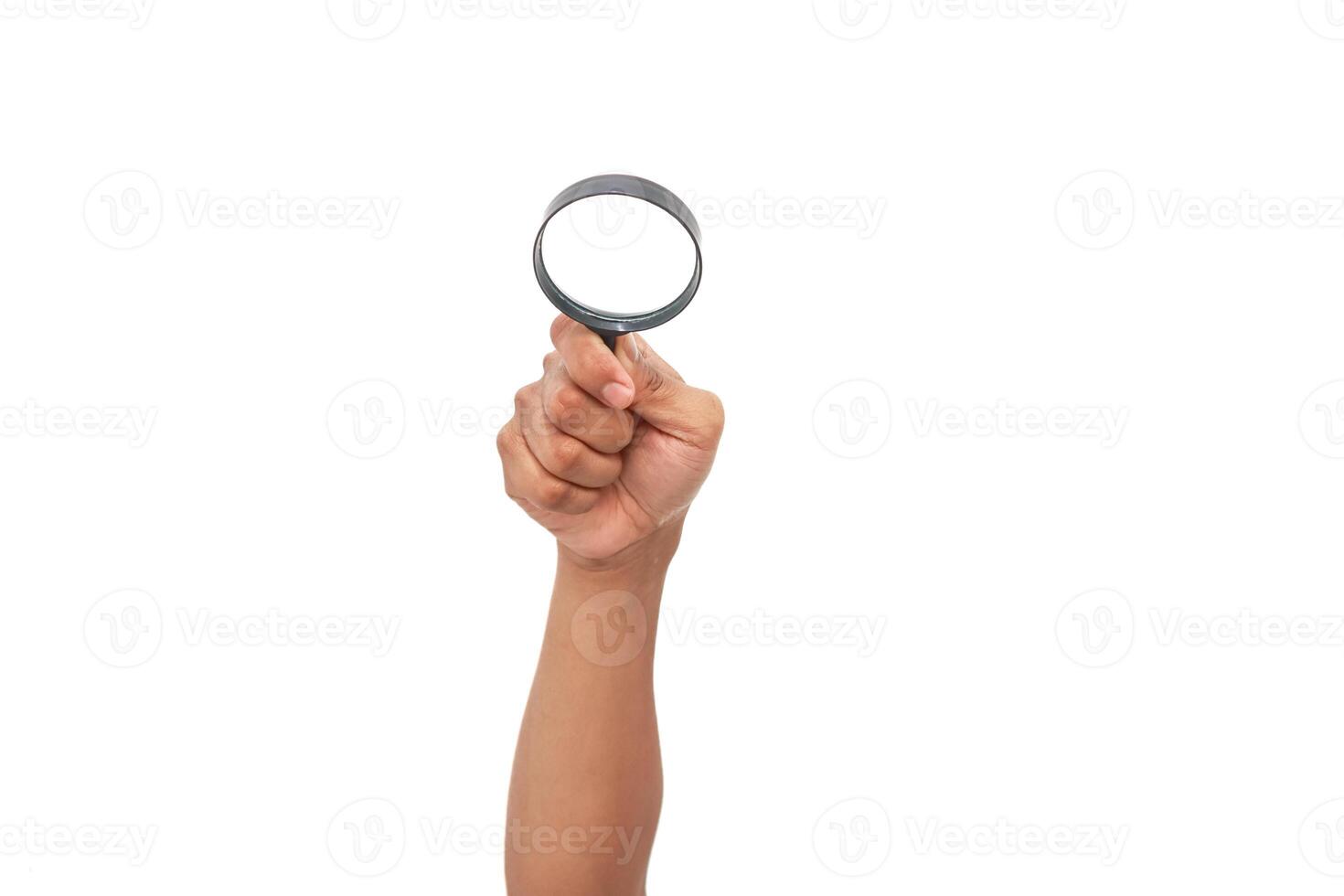 An outstretched hand holds a magnifying glass against a clean white backdrop, symbolizing investigation photo